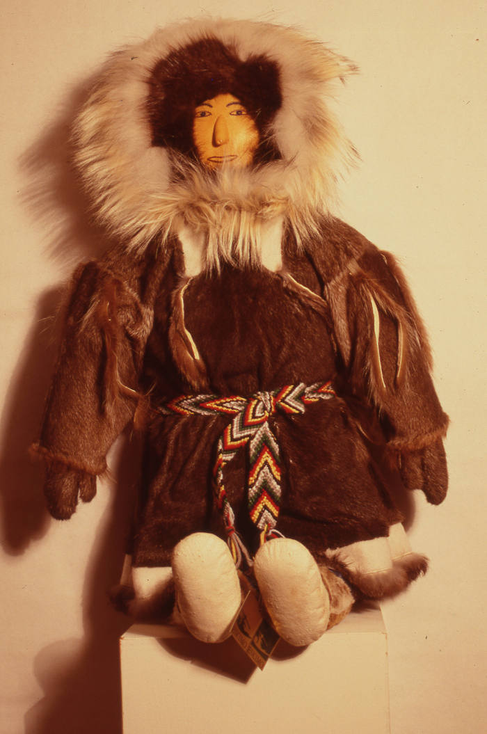 Man, Woman and Child (wearing traditional Netsilingmiut caribou clothing)